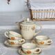 4 vintage ivory earthenware coffee cups and saucers - Floral pattern