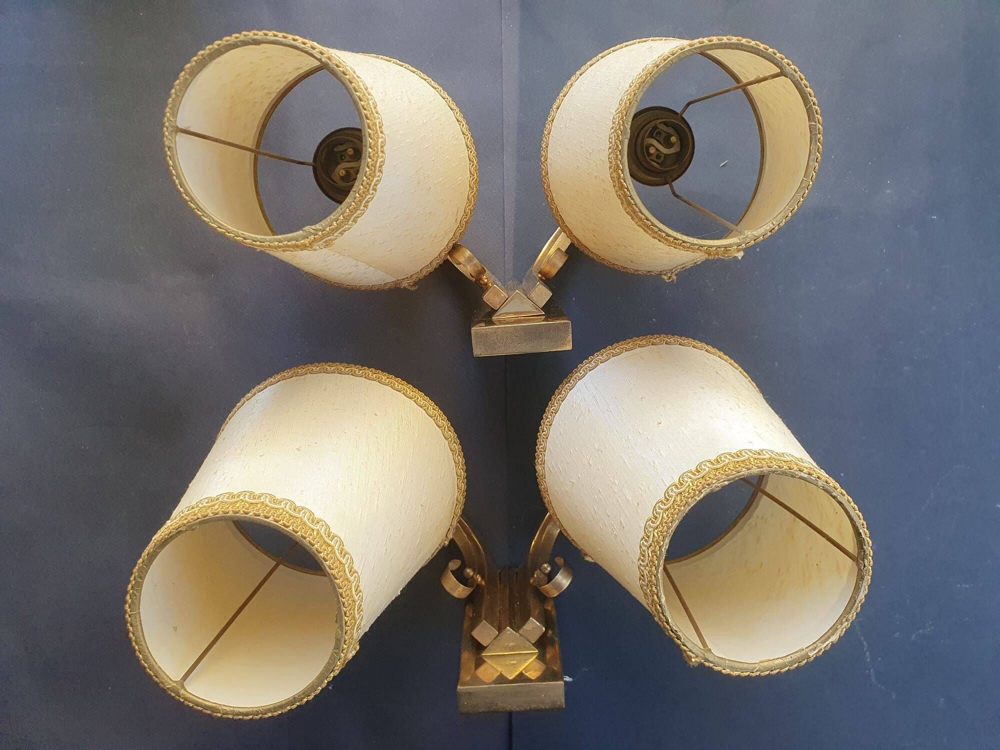 Pair of bronze wall sconces with 1940s Art Deco lampshades.