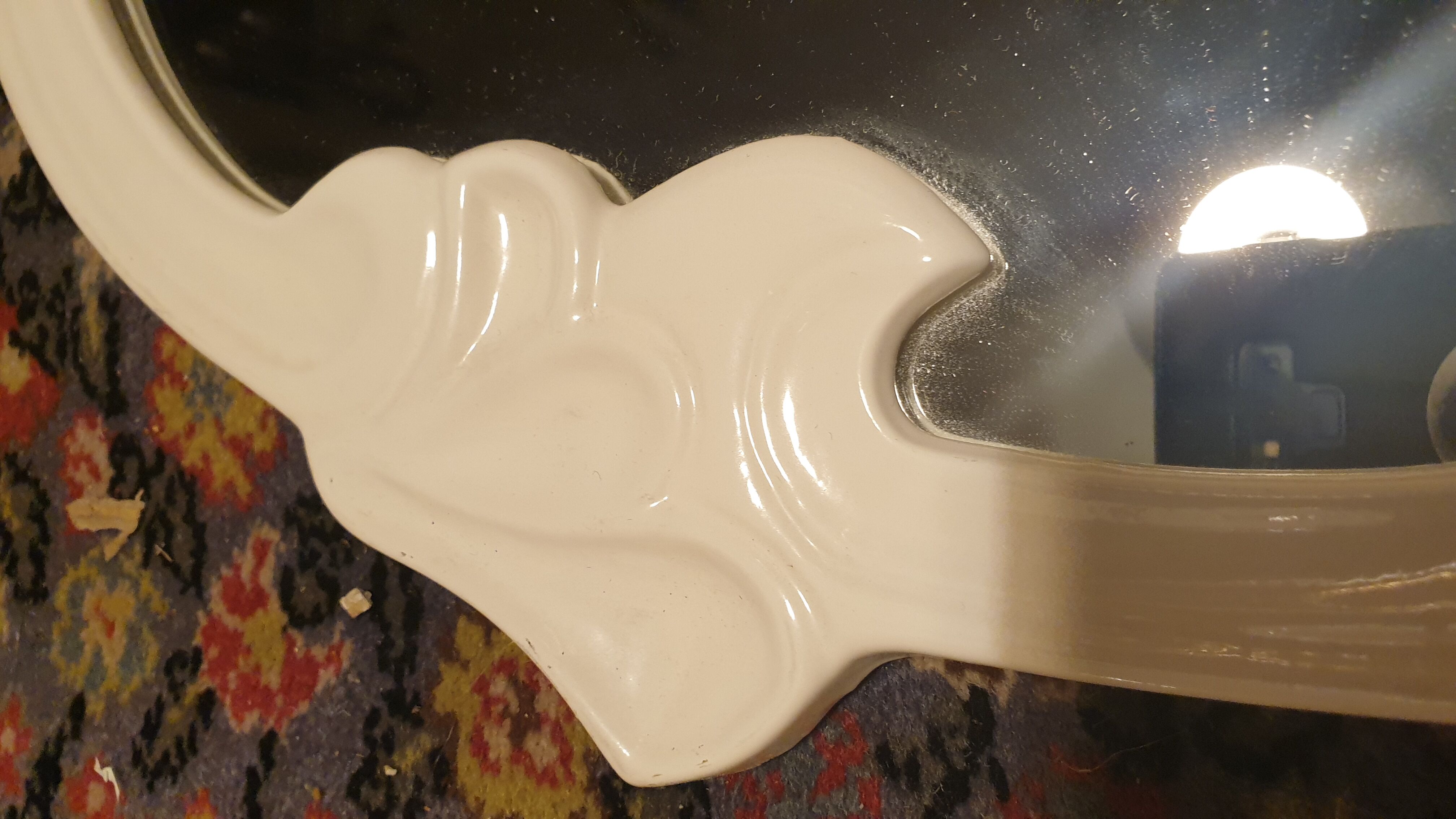 Oval cast iron mirror