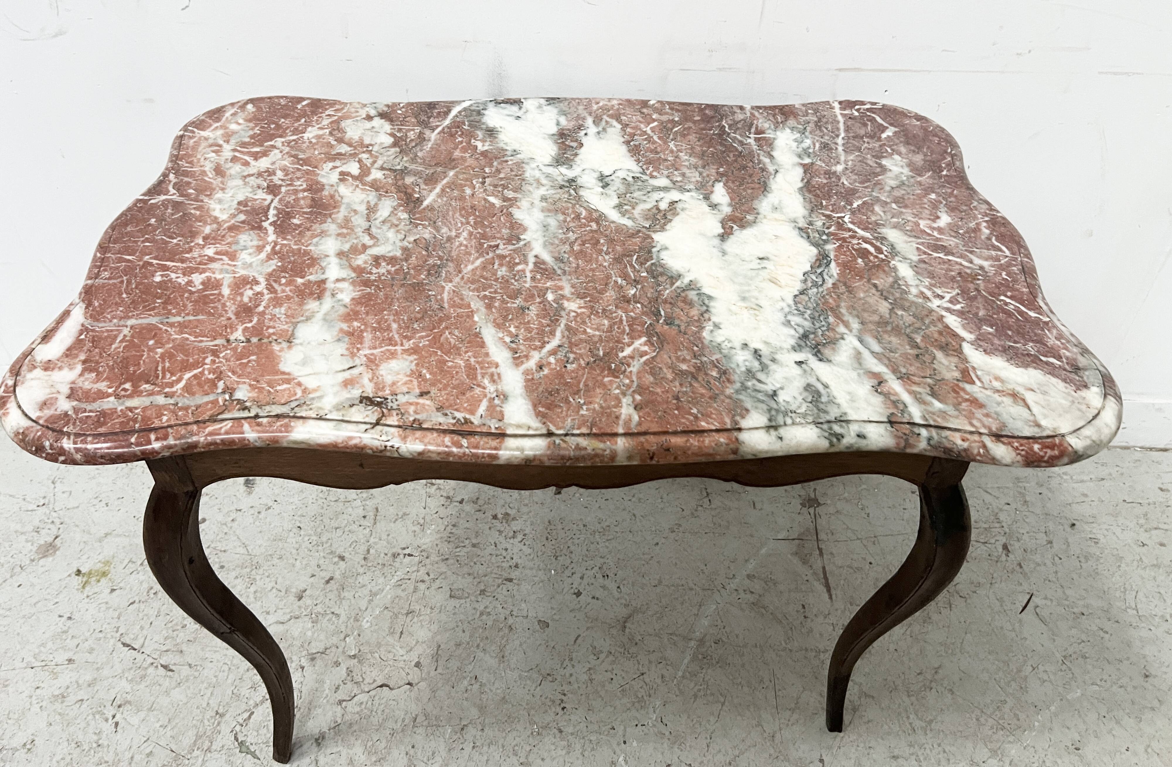 Louis XV mid-table in oak and marble, 18th century.