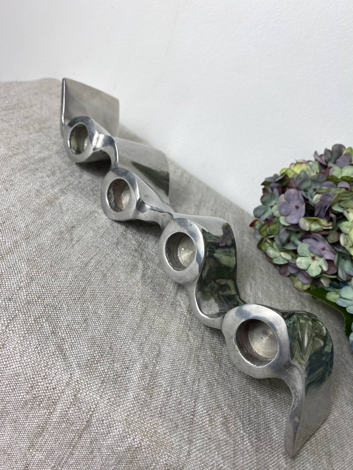 Brushed aluminum candle holder