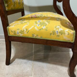 Louis XV style cabriolet armchair in solid wood, yellow floral fabric.