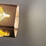 Older hanging lamp, made of metal with yellow prisms.