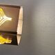 Older hanging lamp, made of metal with yellow prisms.