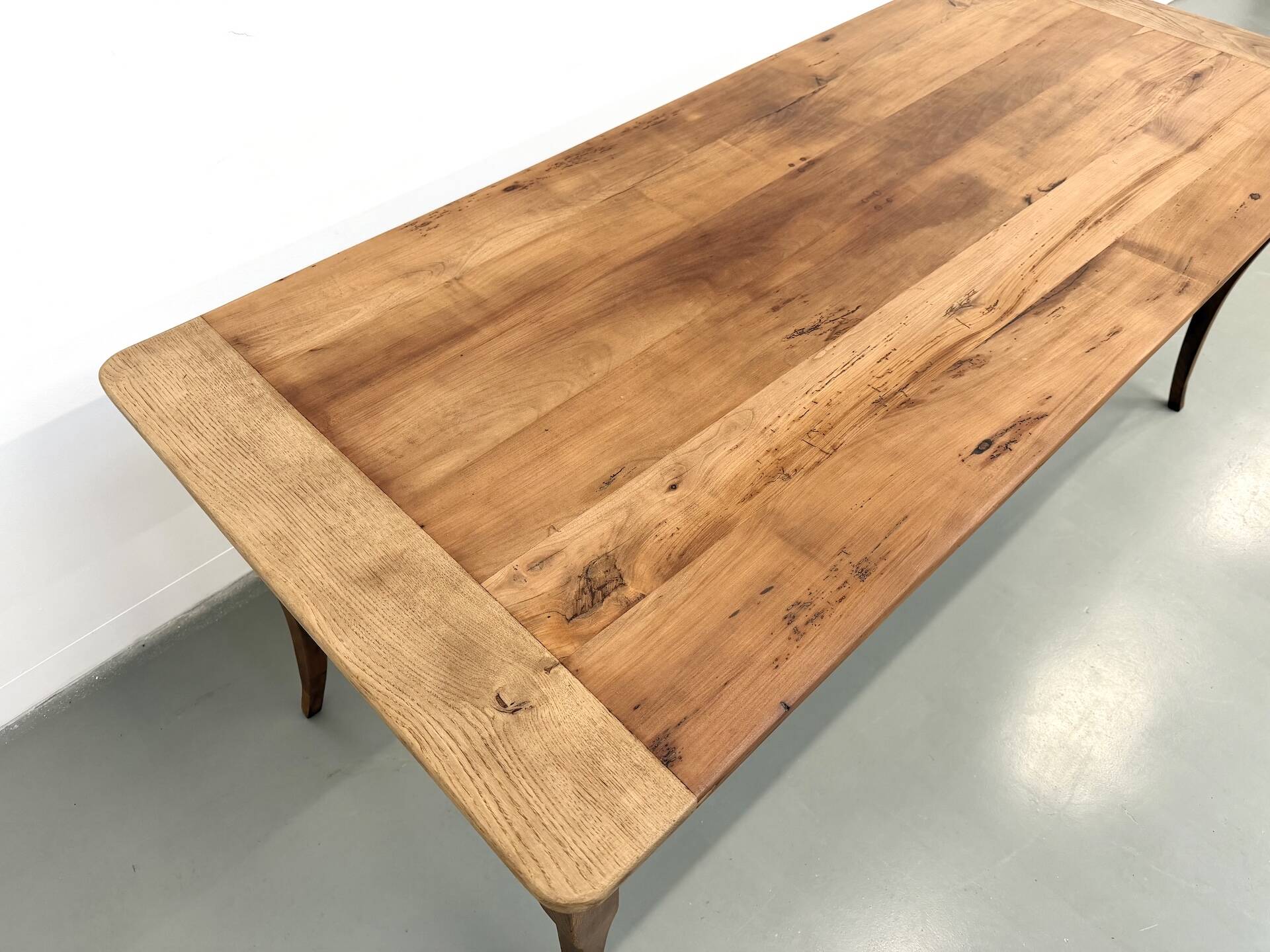 Farm table in solid cherry — Saber legs, Circa 1880