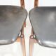 Set of four Arne Vodder chairs in hardwood and black leather.