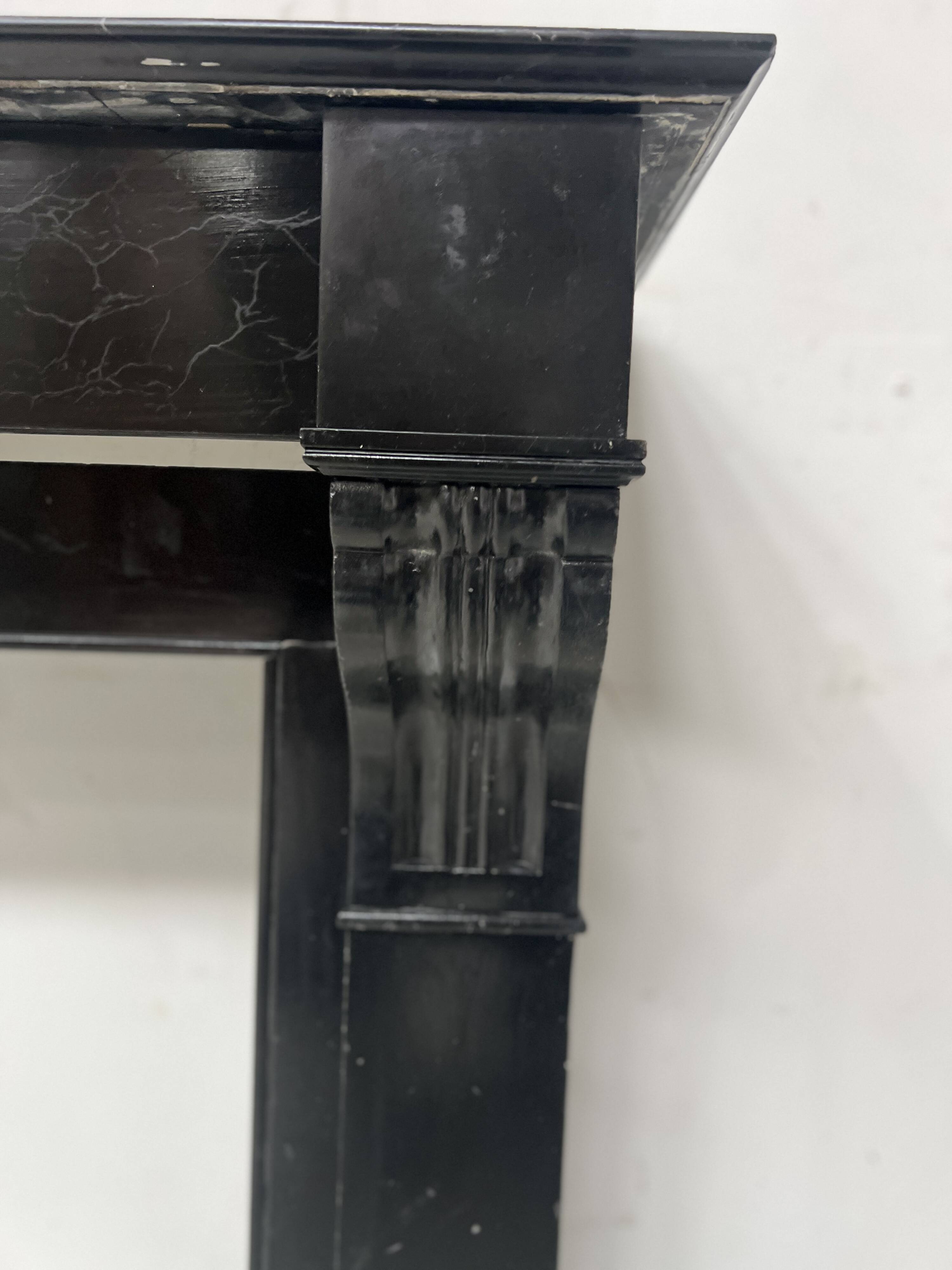 Napoleon III period fireplace with a black marble corbel. 19th century.