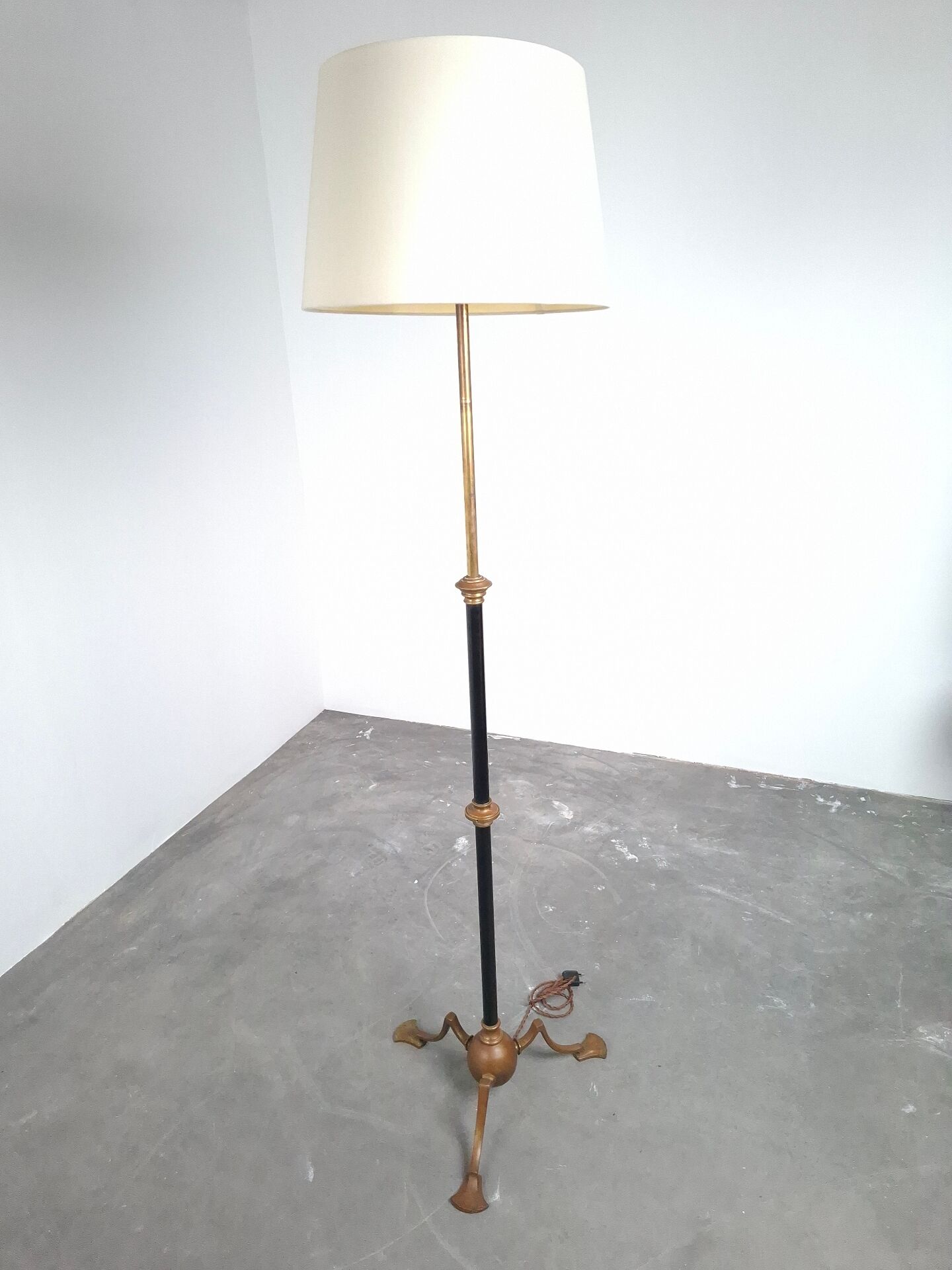 Art and Craft tripod floor lamp in bronze.