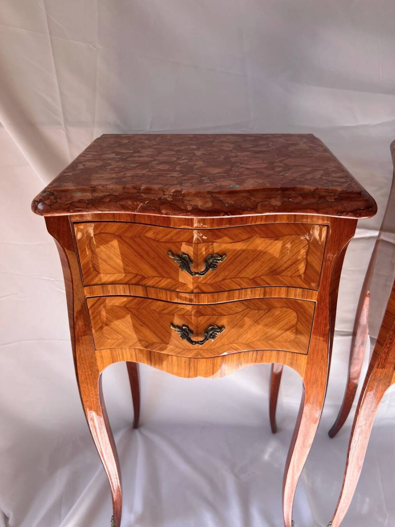 Pair of French rosewood bedside tables, marble top, inlaid beds.