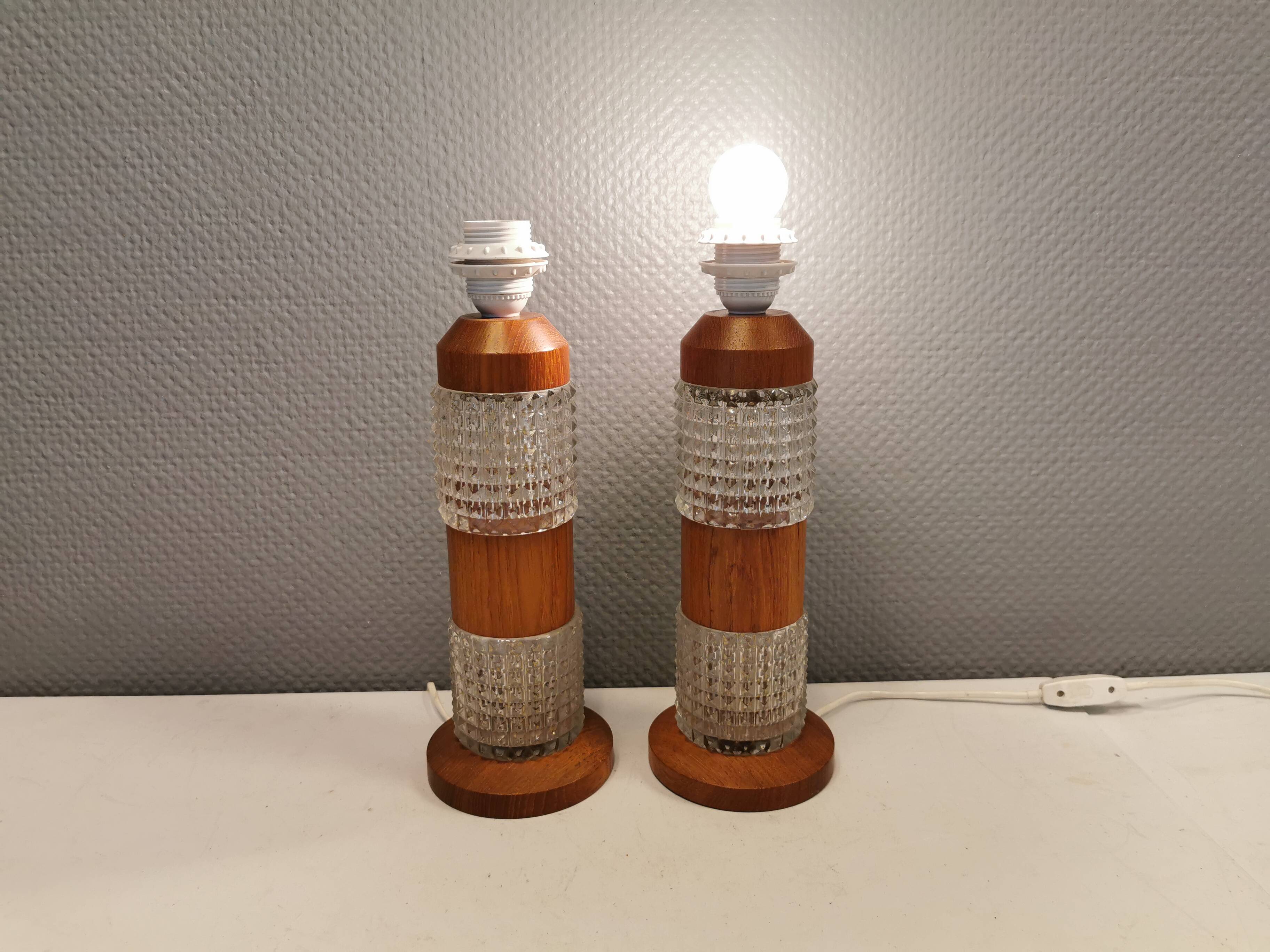 Swedish table lamps made of teak wood and hard pressed crystal glass.