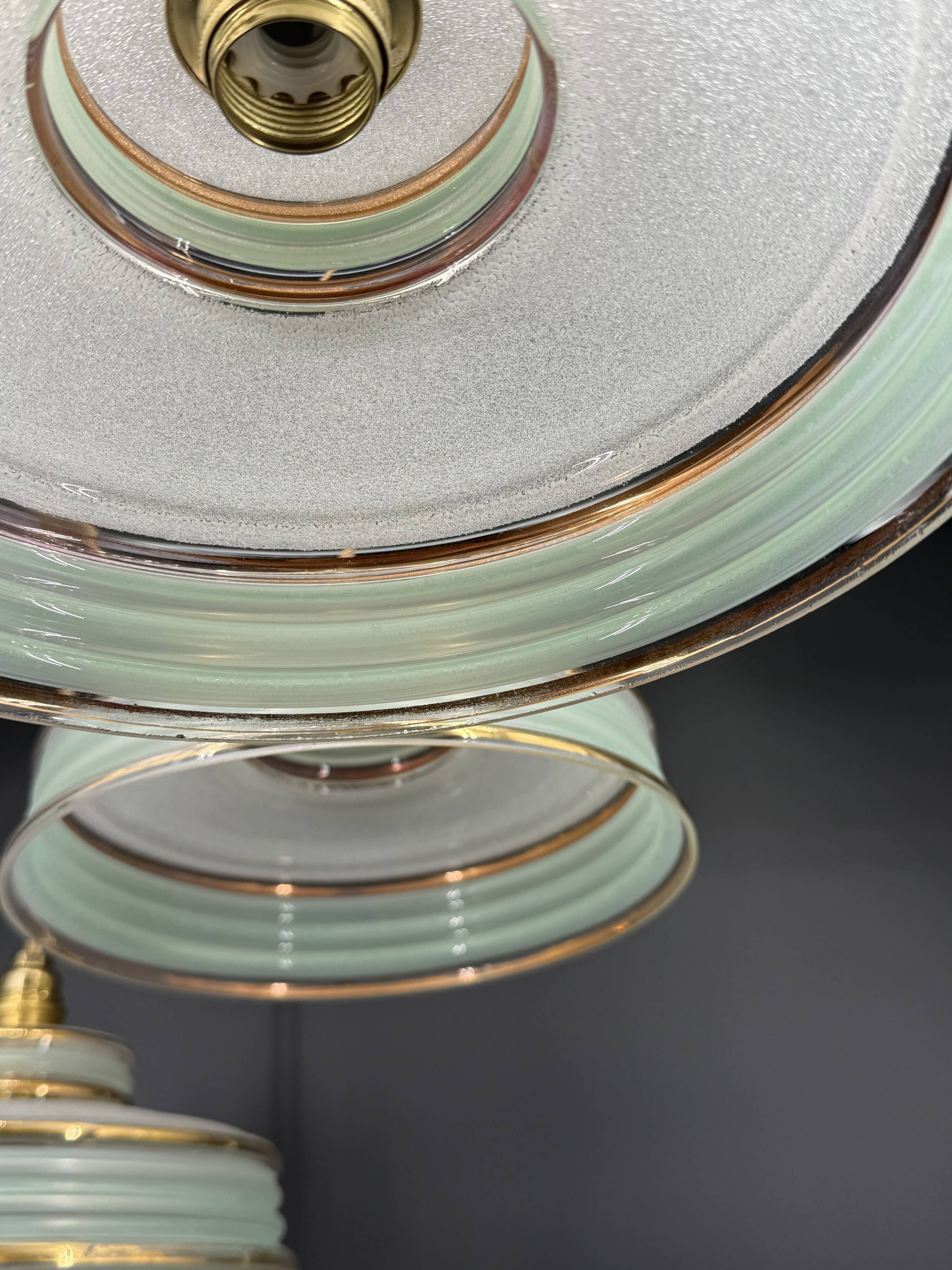 Set of 4 Art Deco pendant lights in frosted water green and gold.