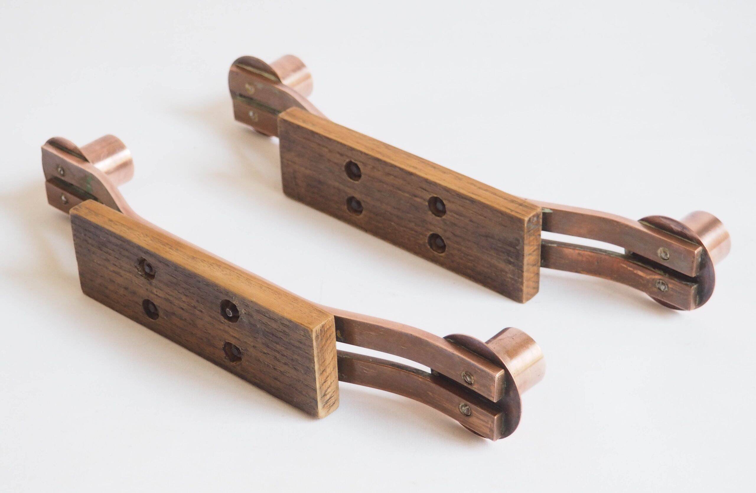 Pair of oak and copper bronze candlesticks