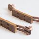 Pair of oak and copper bronze candlesticks