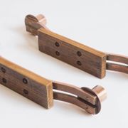 Pair of oak and copper bronze candlesticks