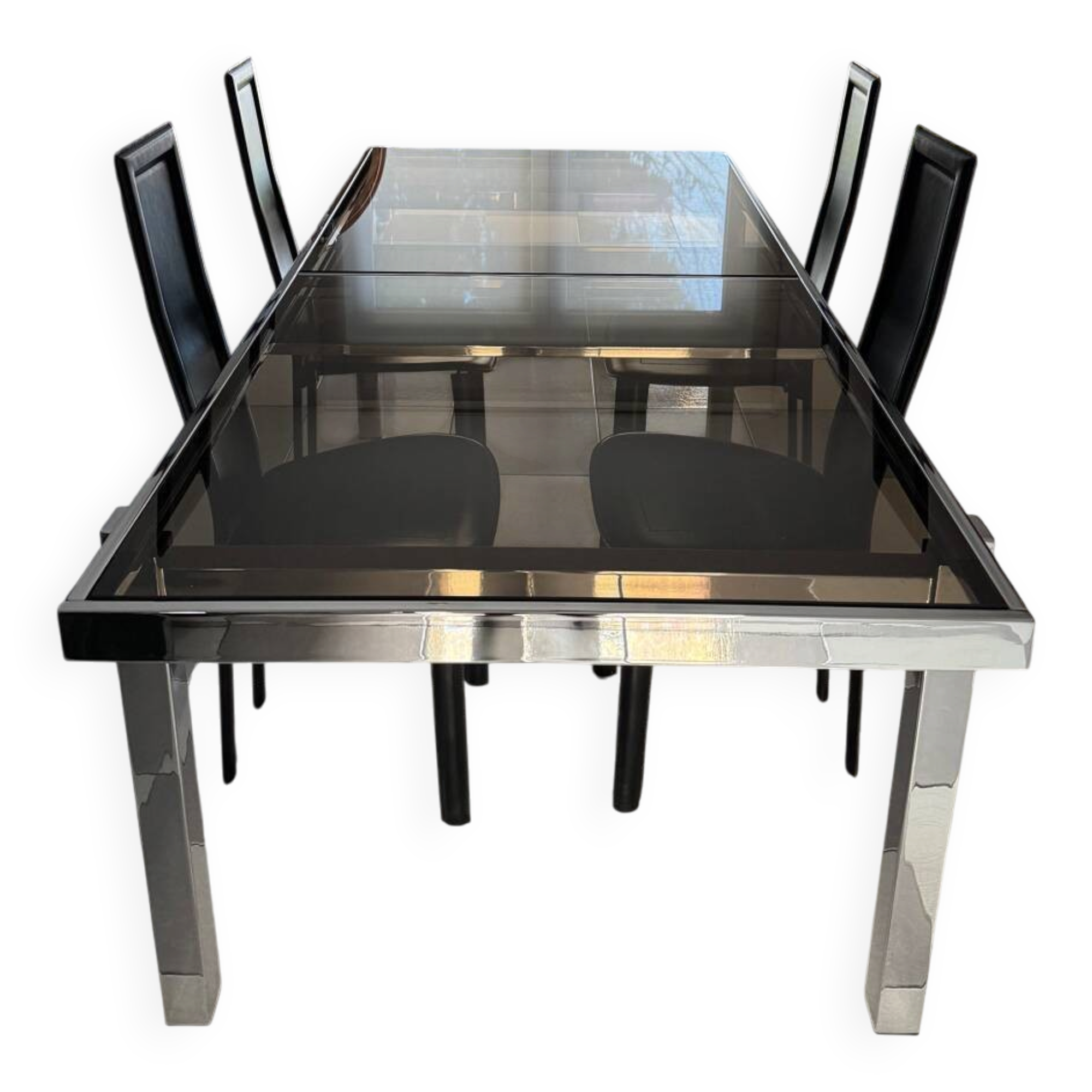 Vintage Roche Bobois dining table with smoked glass and 4 leather chairs.