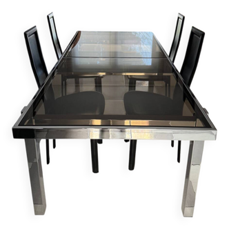 Vintage Roche Bobois dining table with smoked glass and 4 leather chairs.