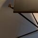 Coffee table in gilded brass, black metal and black opaline top, circa 1950