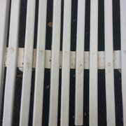 Old garden bench, cast iron feet and white wooden slats