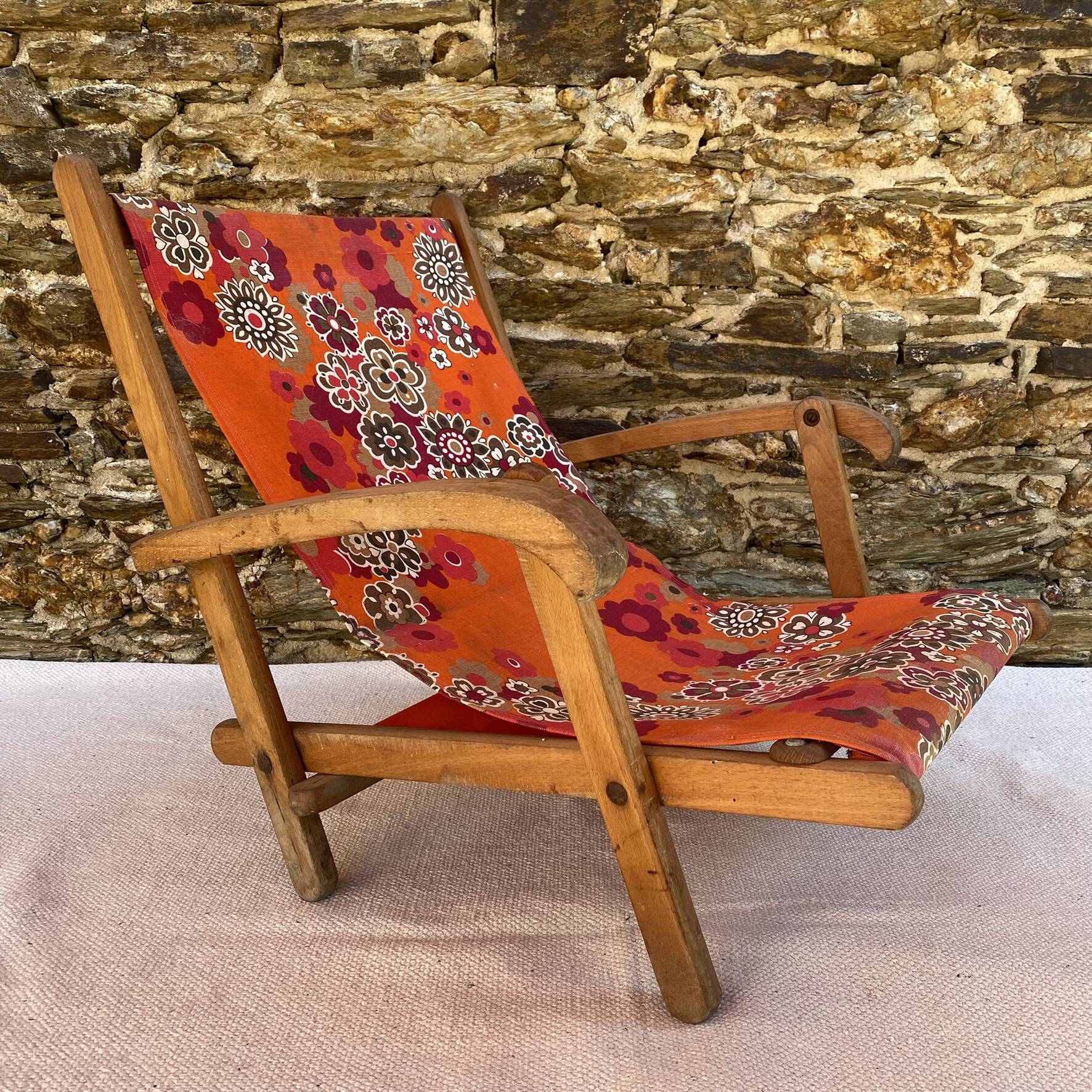 Vintage beach or garden chair made of wood and floral fabric, 1970s.