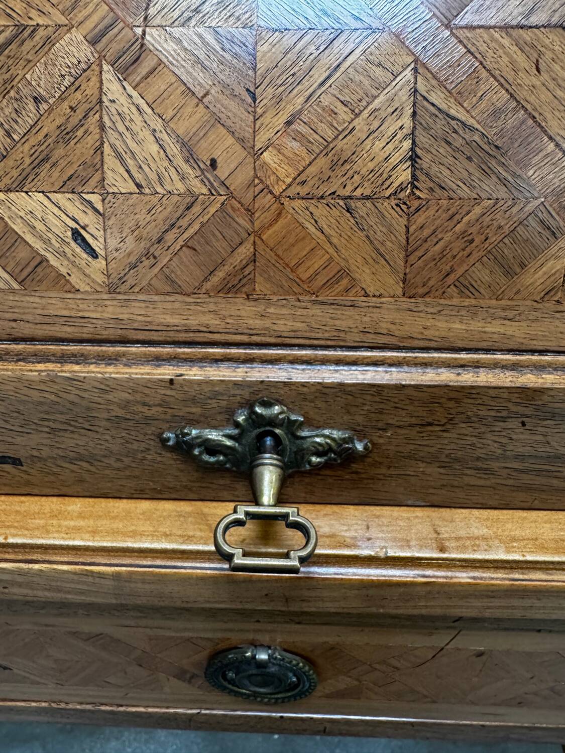 Cylinder desk with marquetry featuring a crosshatch design.