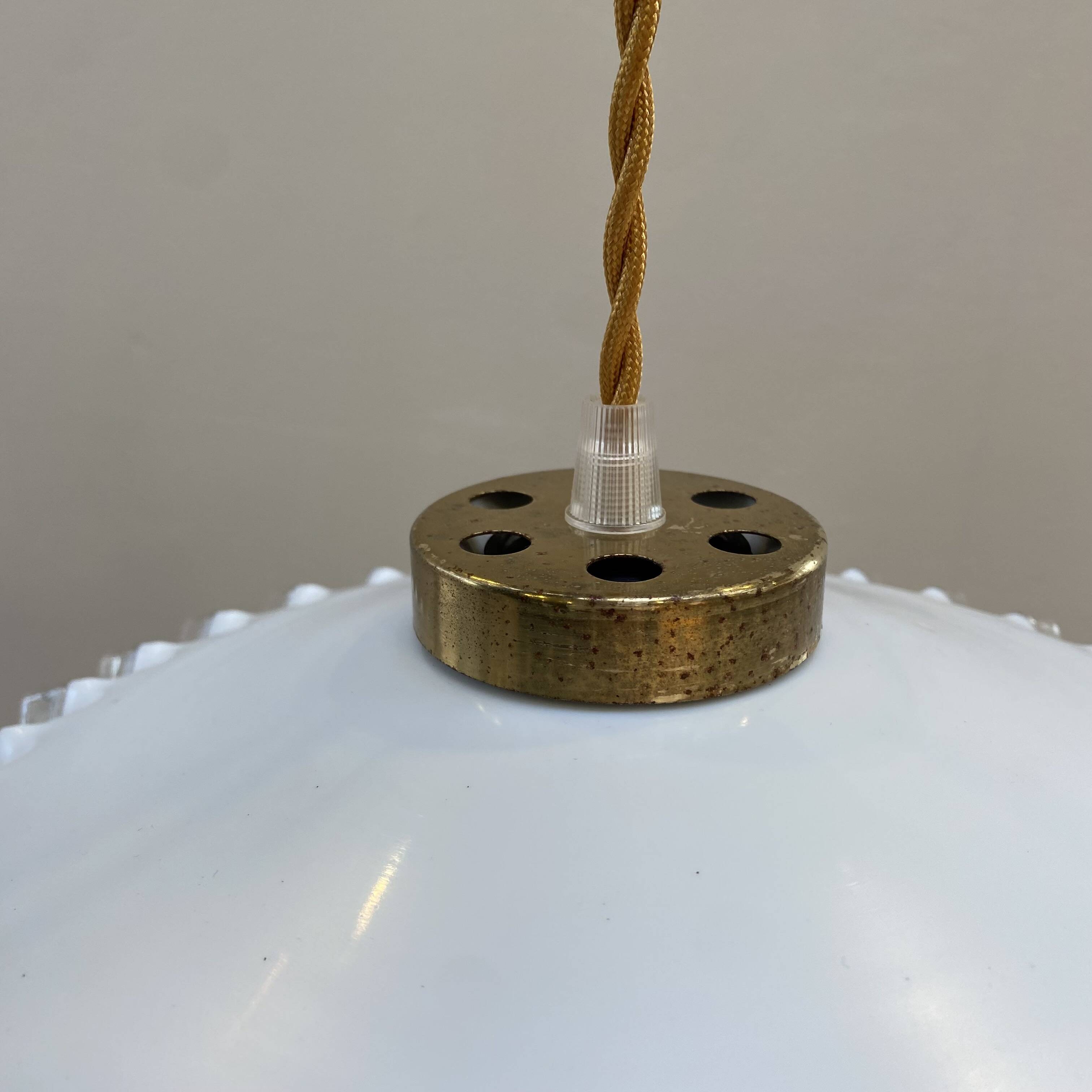 White opaline pendant light with transparent serrated edges