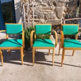 3 vintage bridge chairs with rounded armrests.