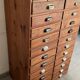 Old apothecary trade furniture in vintage wood 24 drawers.