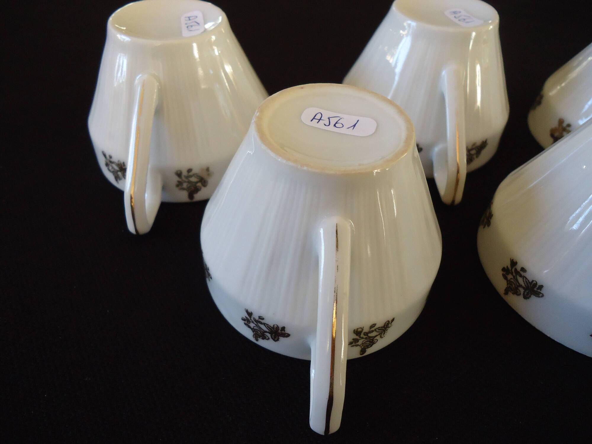 Set of six Art Deco white fine porcelain coffee cups and saucers