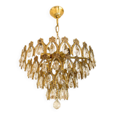 Vintage chandelier in gilded brass with crystal pendants.