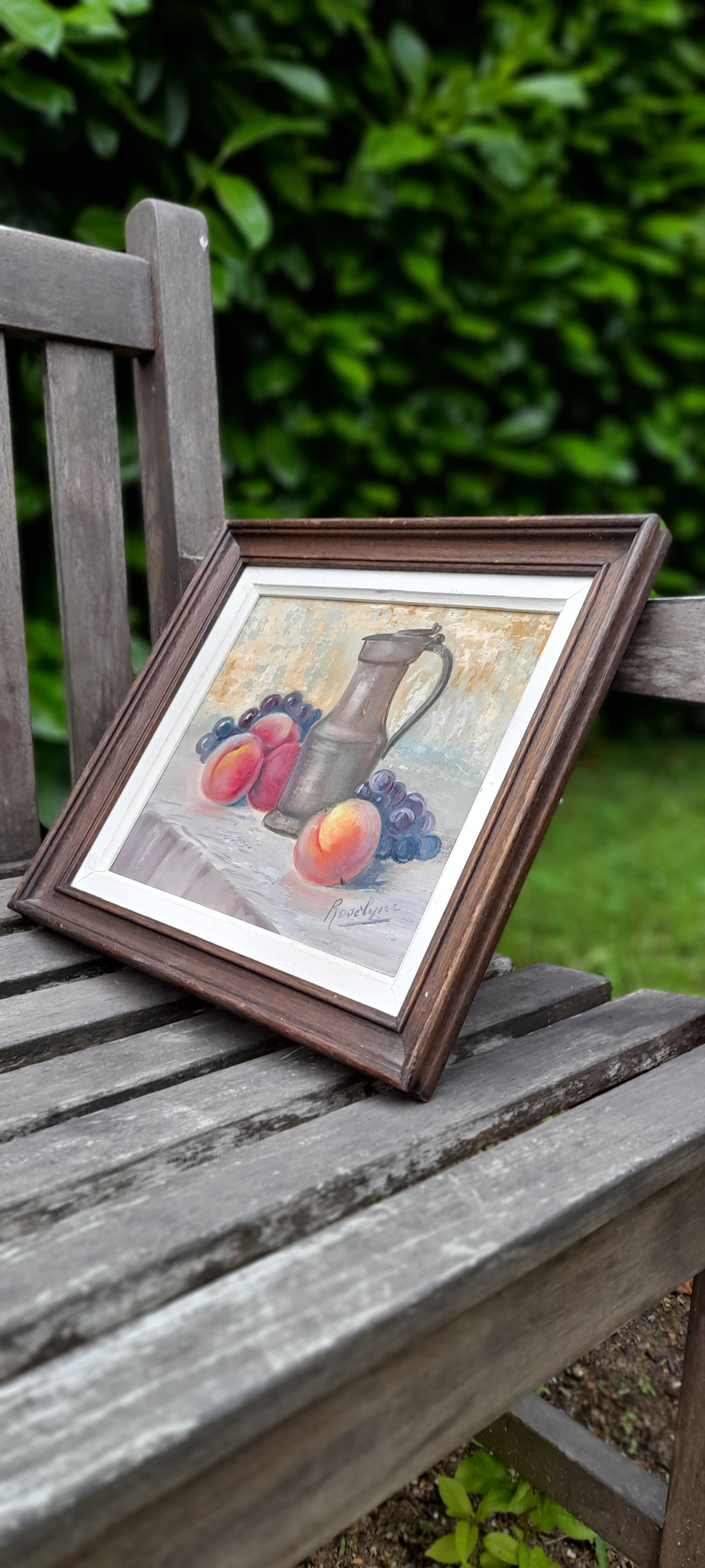 Still life painting with fruit, peach, bunch of grapes and tin pitcher, signed "roselyne"
