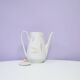 White teapot with pastel flowers