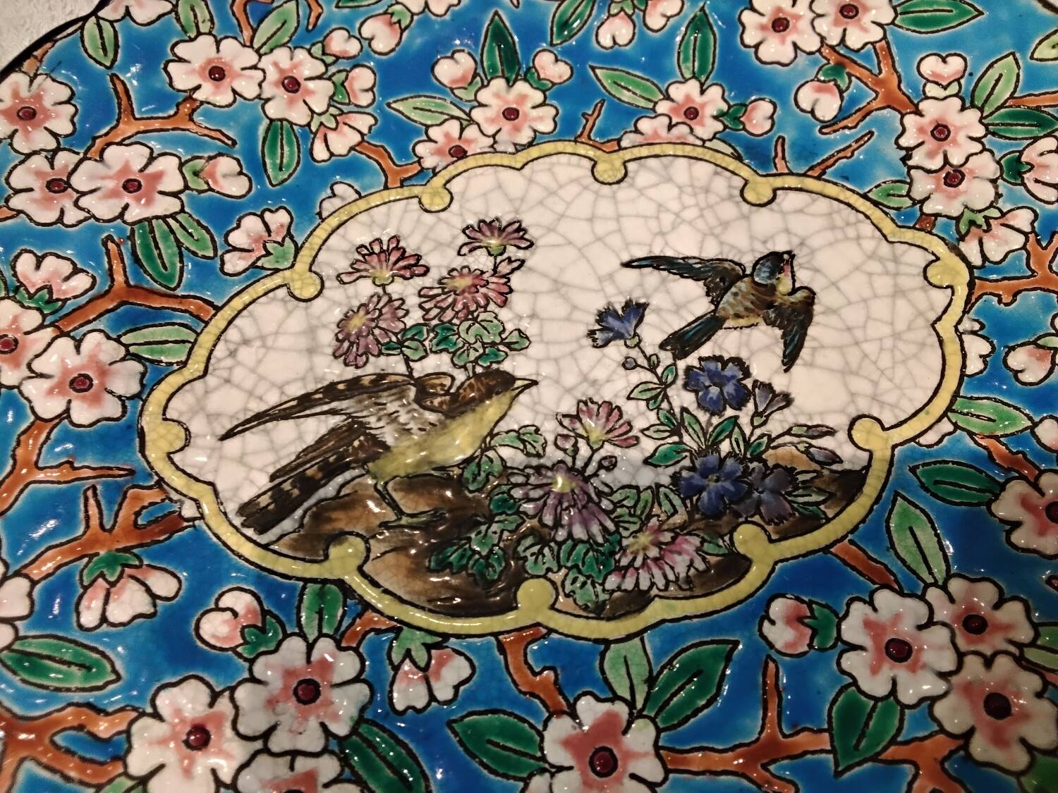 Longwy enamel plate with cartouche of 2 birds and apple blossoms, d188