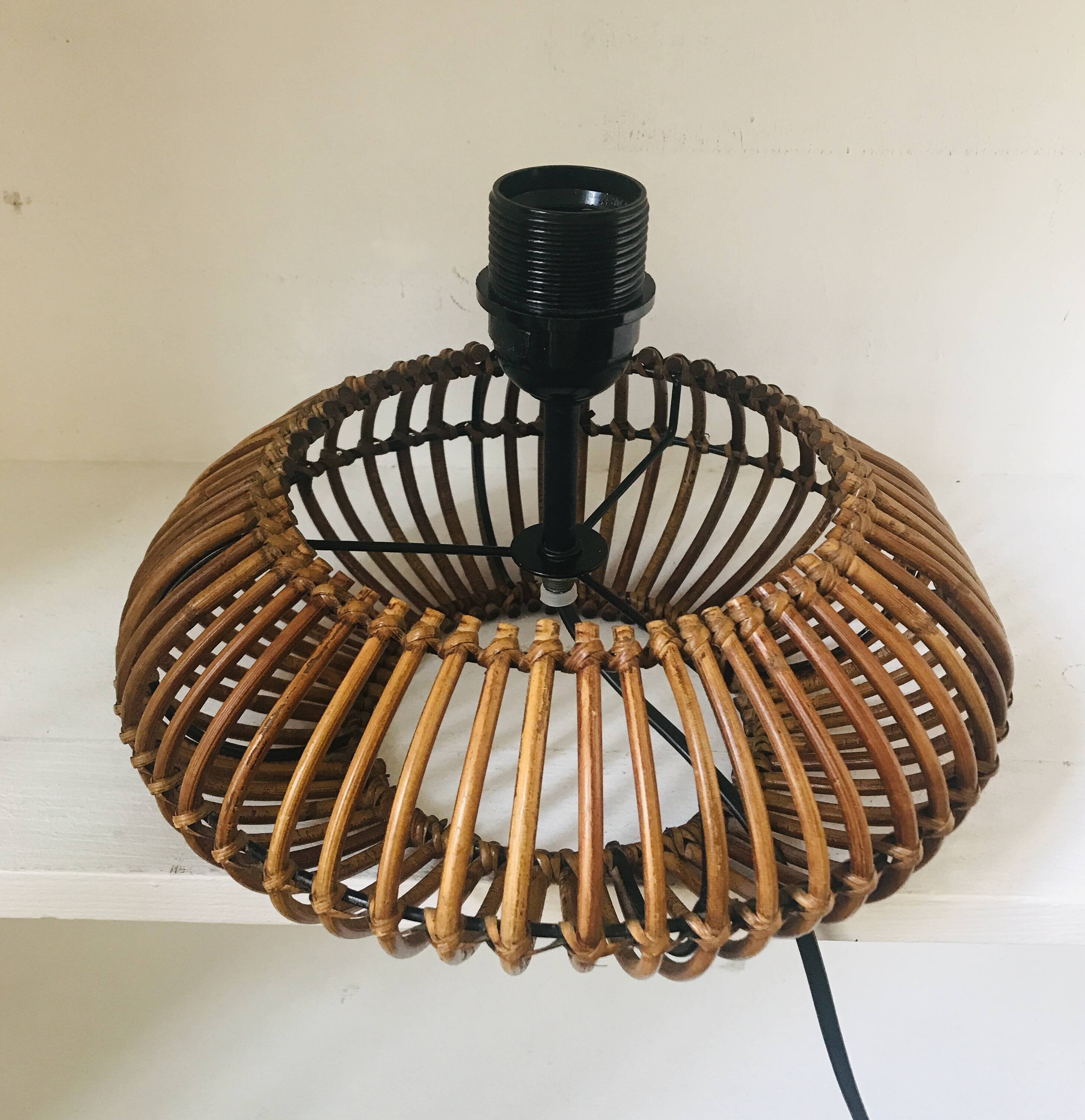 Table lamp with rattan base and papier-mâché hat