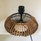 Table lamp with rattan base and papier-mâché hat