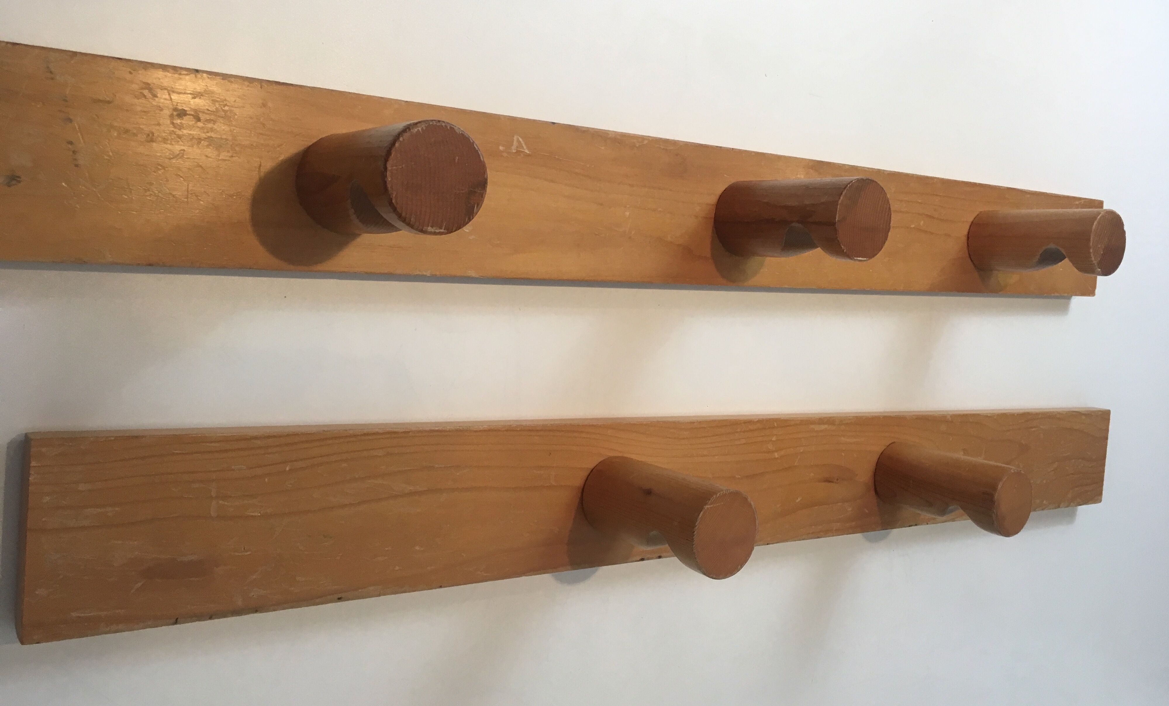 Charlotte Perriand, pair of fir wall coat racks, French work, around 1970
