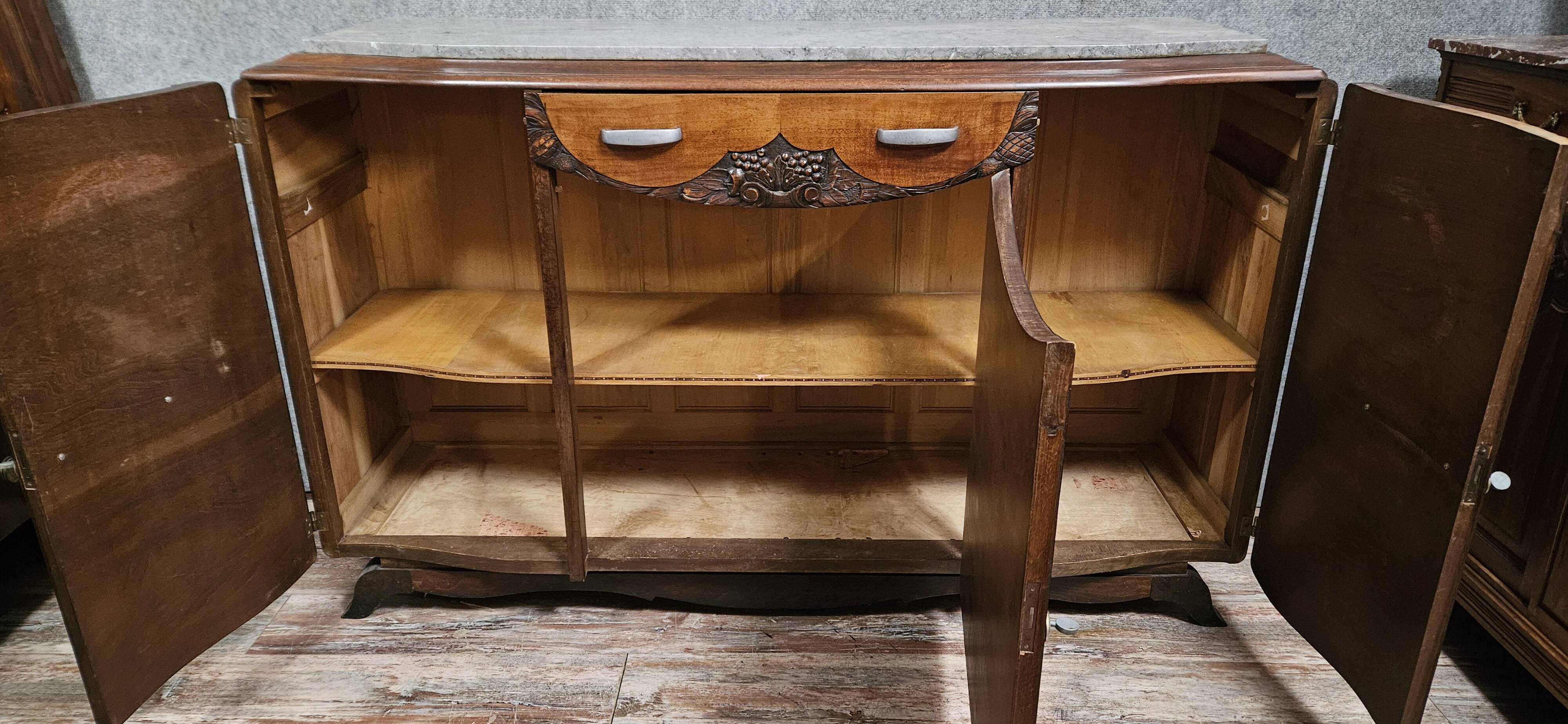 Sideboard in a row, Art Deco period, in mahogany.