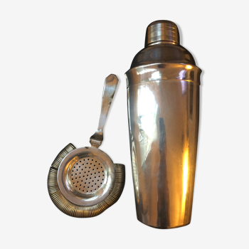 Silver metal shaker and colander