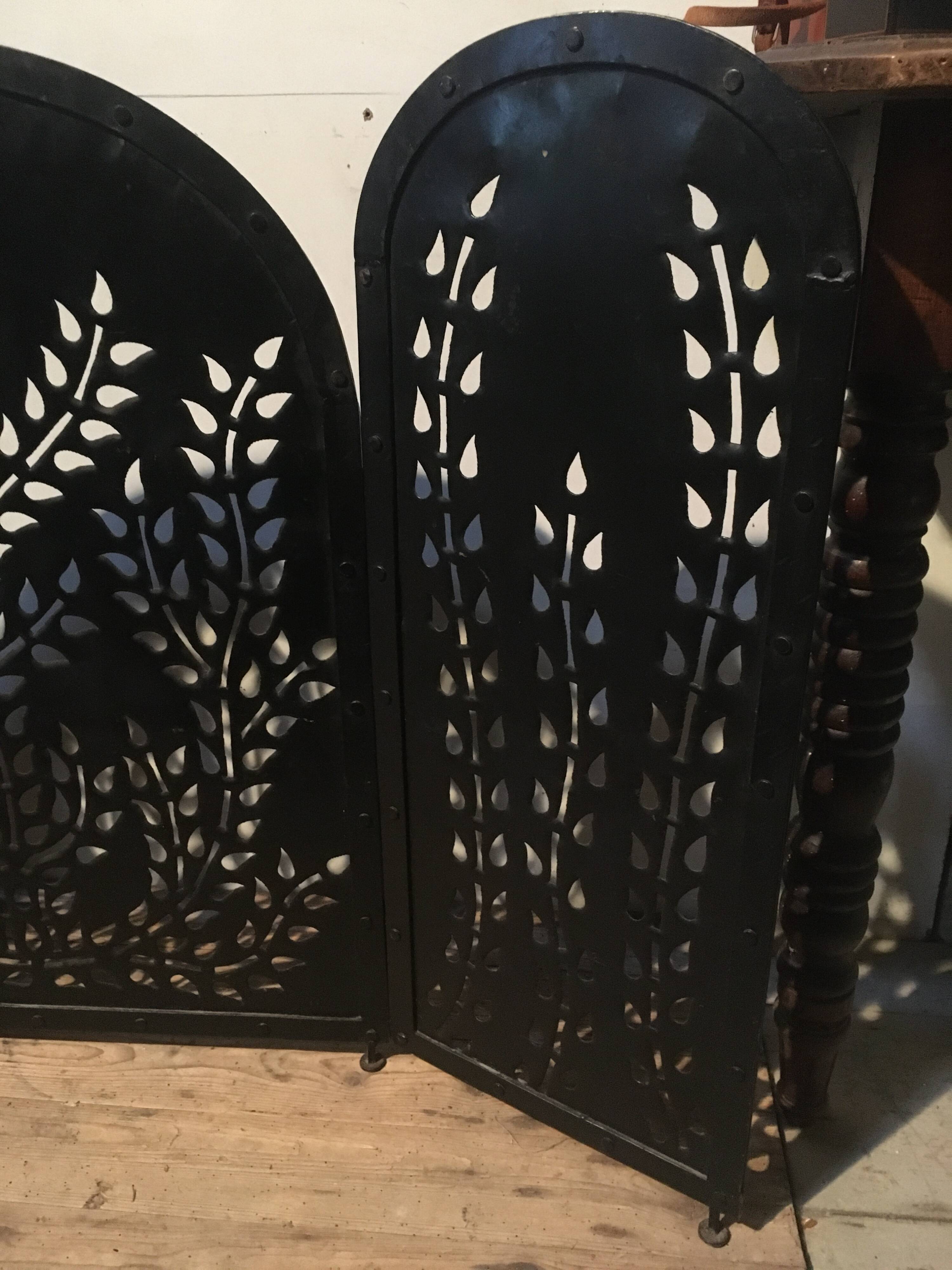 Wrought and cut metal fire screen