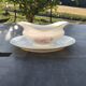 Vintage fine porcelain sauce boat with gold gilding.