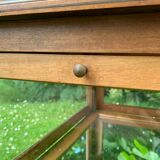 Glass-enclosed old tea table with wooden tray, bronze and brass