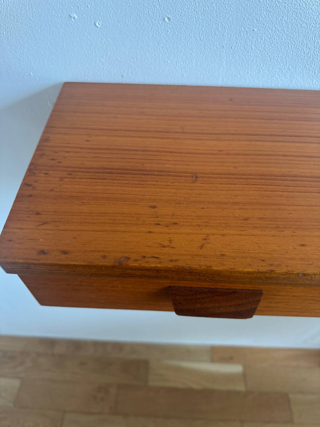 Vintage Scandinavian teak wall-mounted bedside tables.