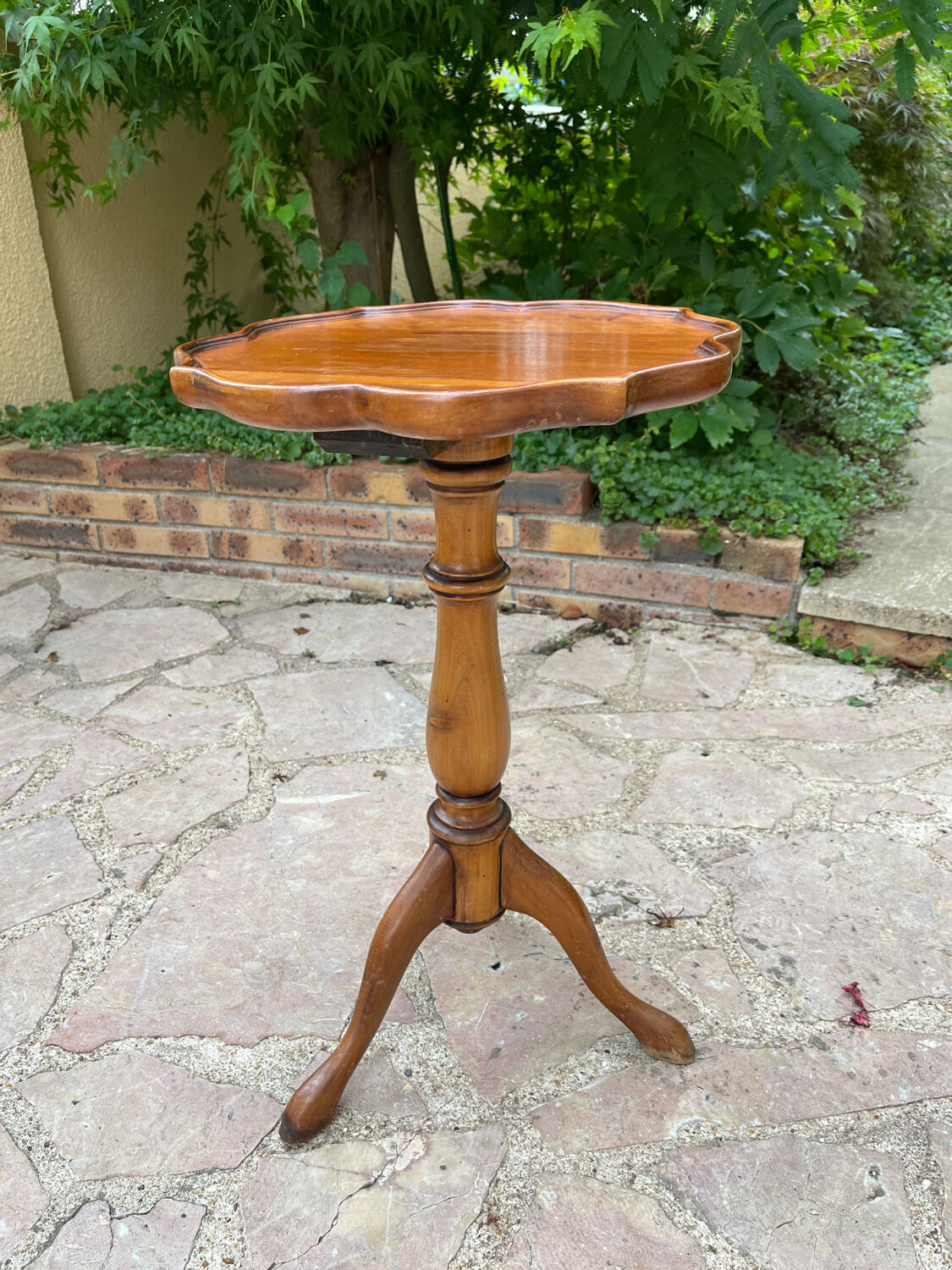 Small wooden pedestal table