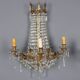 Antique wall sconces in gilded bronze with neoclassical motifs, 20th century.
