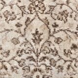 Tapis vintage à motifs floraux beige et marron
