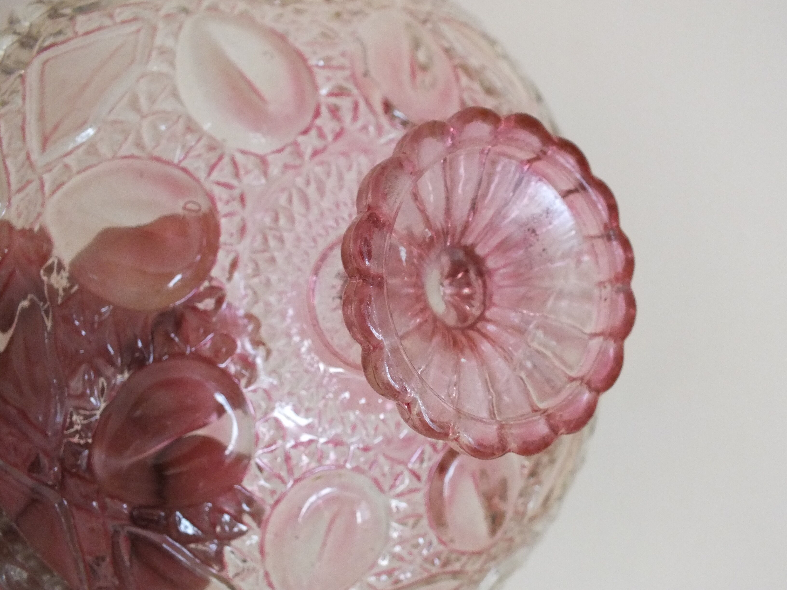 Small pink tinted molded crystal display cup