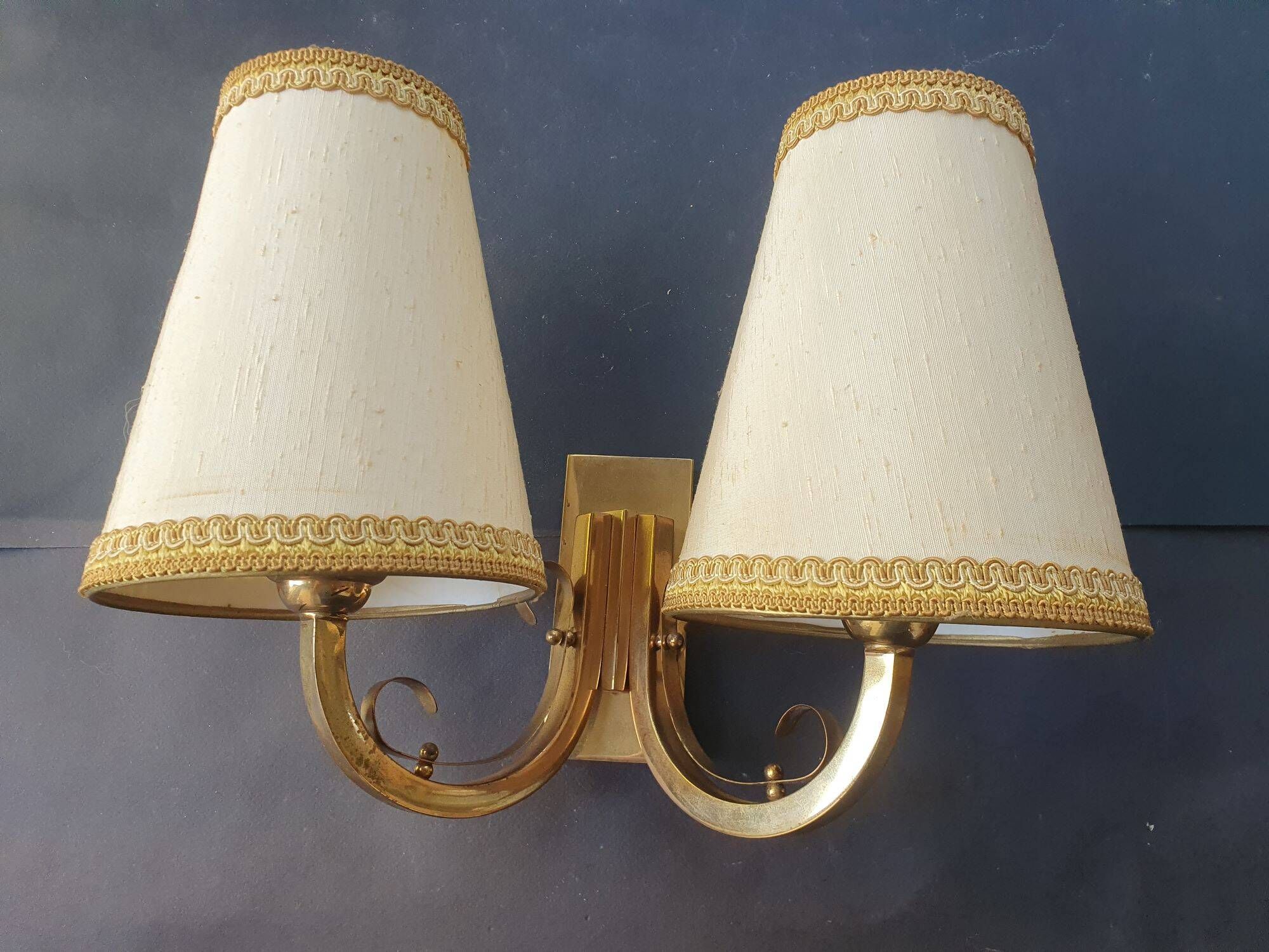 Pair of bronze wall sconces with 1940s Art Deco lampshades.