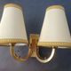 Pair of bronze wall sconces with 1940s Art Deco lampshades.