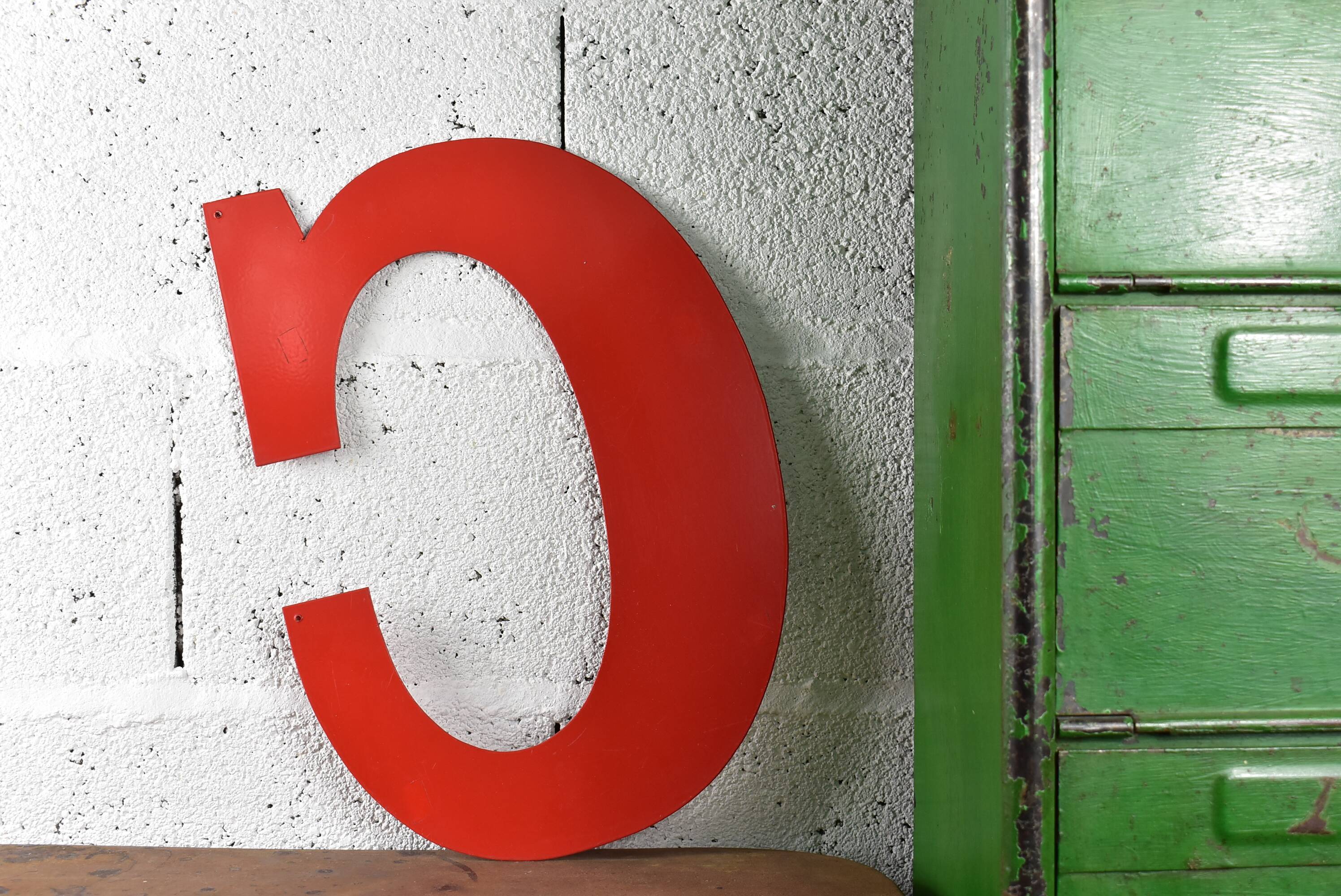 Industrial letter "C" in red metal