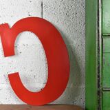 Industrial letter "C" in red metal