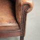 Sheepskin club armchair with patina in a subtle size and a vintage look
